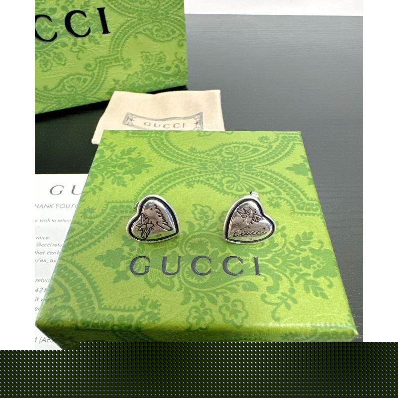G*u*i earrings